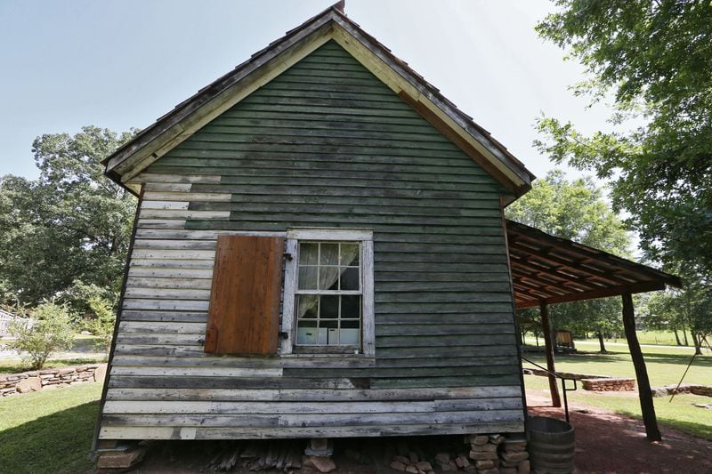 At a time when Georgians are considering which symbols of Southern heritage to preserve, many are unaware of the small number of slave cabins that still exist in the state. Built circa 1850, the Sautee Nacoochee “African American Heritage Site” cabin in White County housed slaves who worked for prominent White County farmer and businessman E. P. White. Over the past 15 years it was restored by a team led by White’s descendants and a descendant of one of his family’s slaves. This one-room cabin had a window, which would have been a luxury. (BOB ANDRES / BANDRES@AJC.COM)