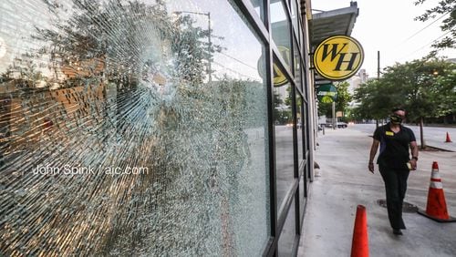 Bullets hit the front of the Waffle House on Courtland Street and injured an innocent bystander, according to a spokeswoman for the restaurant.