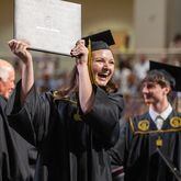 Rebecca Verlander reacts after receiving her diploma at Kennesaw State University on Tuesday, May 7, 2014.  (Steve Schaefer / AJC)
