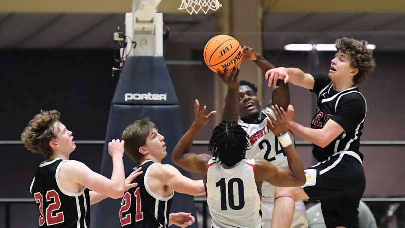 March 10, 2021 Macon - Mt. Pisgah's Nate Gordon (24) manages to grab a rebound as he falls during the 2021 GHSA State Basketball Class A Private Championship game at the Macon Centreplex in Macon on Wednesday, March 10, 2021. Mt. Pisgah won 43-41 over Holy Innocents. (Hyosub Shin / Hyosub.Shin@ajc.com)