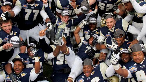 Georgia Tech players celebrate their 21-7 win over Southern California in the Sun Bowl NCAA college football game, Monday, Dec. 31, 2012, in El Paso, Texas.