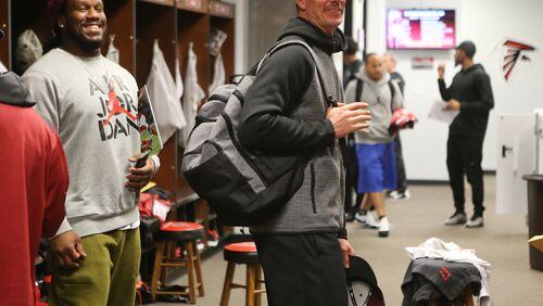 010416 FLOWERY BRANCH: Falcons defensive tackle Jonathan Babineaux and quarterback Matt Ryan pack up after their team meeting the day after losing to the Saints to finish their season at 8-8 on Monday, Jan. 4, 2016, in Flowery Branch. Curtis Compton / ccompton@ajc.com
