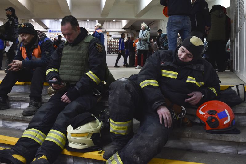 People take shelter in a metro station during an air-raid alarm in Dnipro, Ukraine, Friday, April 19, 2024. (AP Photo/Andriy Andriyenko)