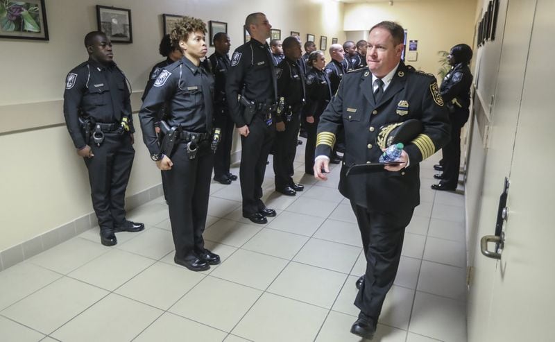 DeKalb County Police Chief J.W. Conroy walks past the 114th Police Academy graduation class before their ceremony on Friday, Dec. 14, 2018, at the Manuel J. Maloof Auditorium in Decatur. The new graduates became officers just one day after a DeKalb County cop — Officer Edgar Flores, age 24 — was killed in the line of duty. 
