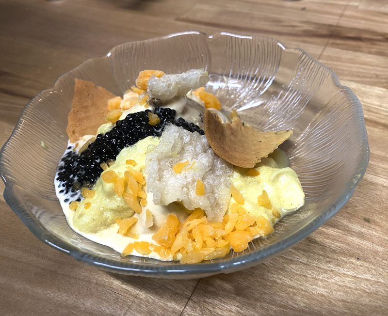 A recent intermezzo course, available for a $30 upcharge at Bovino After Dark, featured a combination of foie gras ice cream with maple waffle cone pieces, crispy chicken skin and caviar. Ligaya Figueras/lfigueras@ajc.com