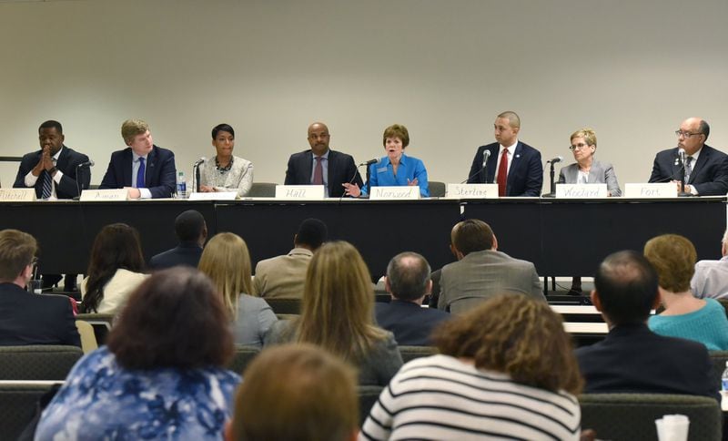 February 24, 2017 — Atlanta mayoral candidates (from left) Ceasar Mitchell, Peter Aman, Keisha Lance Bottoms, Kwanza Hall, Mary Norwood, Michael Sterling, Cathy Woolard and Vincent Fort attend a candidates forum at the Georgia State Bar headquarters. HYOSUB SHIN / HSHIN@AJC.COM