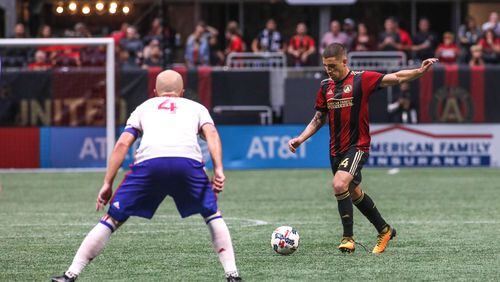 Atlanta United midfielder Carlos Carmona (14) looks to pass while being defended by Toronto FC midfielder Michael Bradley (4) during a MLS game at Mercedes-Benz Stadium, Sunday, Oct. 22, 2017, in Atlanta.  BRANDEN CAMP/SPECIAL