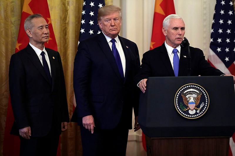 Vice President Mike Pence speaks as President Donald Trump and Chinese Vice Premier Liu He, listen in the East Room of the White House, Wednesday in Washington, before they sign a trade agreement.