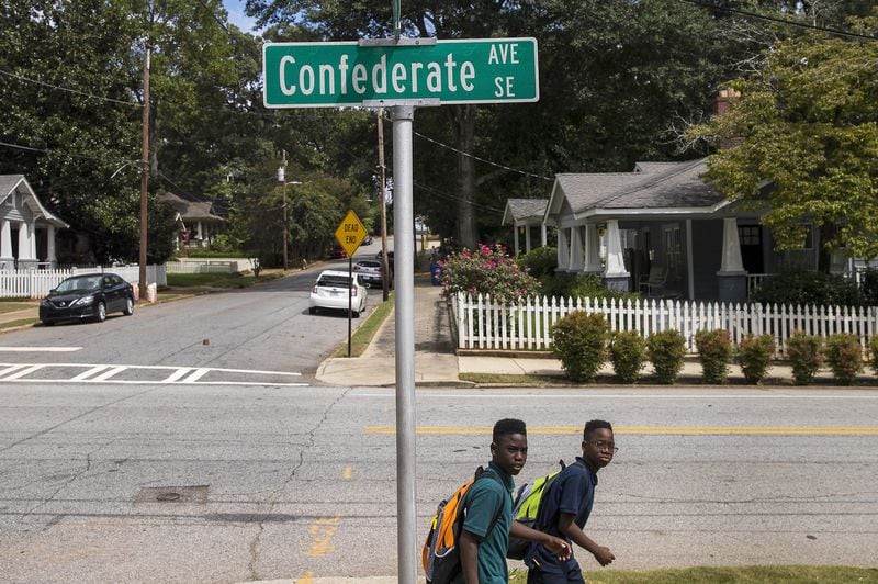 Two young boys walk along Confederate Avenue SE in Atlanta on Sept. 6, 2018. 