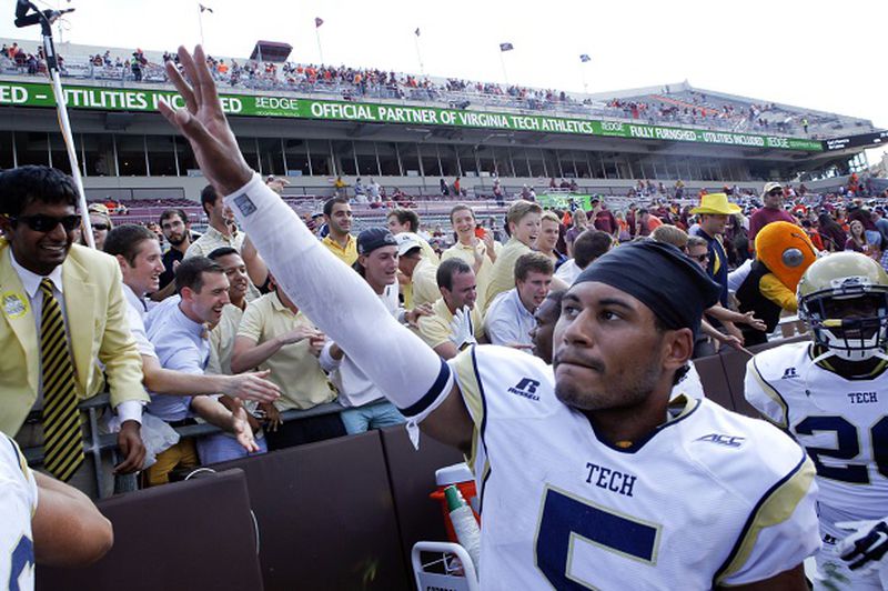 Georgia Tech quarterback Justin Thomas (5) celebrates after an NCAA college football game against Virginia Tech in Blacksburg, Va., Saturday, Sept. 20, 2014. (AP Photo/The Roanoke Times, Matt Gentry) LOCAL TV OUT; SALEM TIMES REGISTER OUT; FINCASTLE HERALD OUT; CHRISTIANBURG NEWS MESSENGER OUT; RADFORD NEWS JOURNAL OUT; ROANOKE STAR SENTINEL OUT A triumphant Justin Thomas greets his constituency. (AP photo by Matt Gentry of the Roanoke Times)