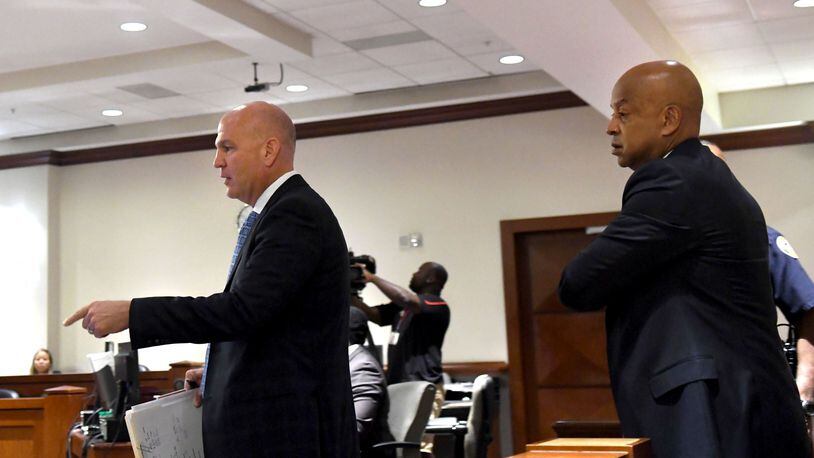 Attorney Noah Pines (left) and Dekalb County Sheriff Jeff Mann (right) walk into the courtroom at the Atlanta Municipal Court in Atlanta on Thursday. Mann pleaded guilty to charges of obstruction and prohibited conduct stemming from his arrest in Piedmont Park. (REBECCA BREYER)