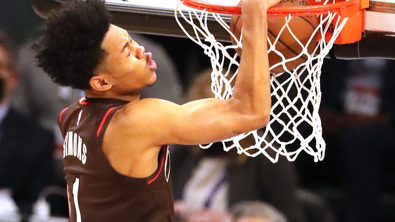 Anfernee Simons of the Portland Trail Blazers slams it home to win the Slam Dunk contest during halftime of the NBA All-Star Game Sunday, March 7, 2021, at State Farm Arena in Atlanta. (Curtis Compton / Curtis.Compton@ajc.com)