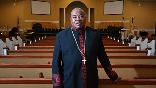 Bishop Melvin McCluster, seen here at Friendship Missionary Baptist Church in Americus, has still not reopened his church following the pandemic. Now he preaches his Sunday sermon on Facebook. It's difficult for him not to see the faces of his congregation as he speaks to them. But he and parishioners don't want to risk it, after entire families got infected and they lost four members to COVID-19. Sumter County, whose population is just over half African-American, has a long history grappling with the fight against racism. Now it is grappling with the coronavirus' disproportionate impact on Black Americans, who are more likely to get sickened by and die from COVID-19. According to health officials, the struggles against racism and the virus are fused. (Hyosub Shin / Hyosub.Shin@ajc.com)