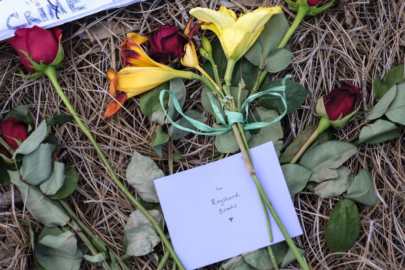 June 13, 2020 -  Protesters leave flowers outside the Atlanta Wendy's where 27-year-old Rayshard Brooks was shot and killed during a struggle with police.
 Ben Gray for the Atlanta Journal Constitution