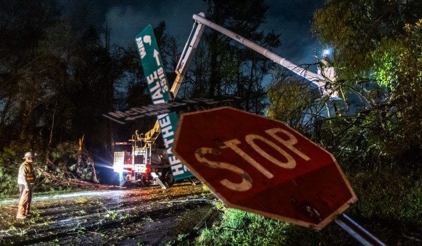 Power crews were hard at at work early Wednesday morning, April 3, 2024, dealing with severe storm damage in Rockdale County. (John Spink / John.Spink@ajc.com)