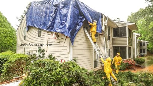Gwinnett County firefighters responded just after 5 a.m. Friday to a report of a tree down on a building at the Columns at Peachtree Corners apartments.