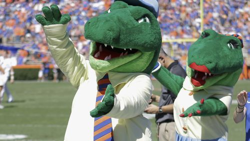 The University of Florida is ending its “gator bait” cheer at football games and other sports events because of its racial connotations.