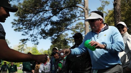 Jason Day talks with a patron after his shot landed in the patron's beverage during the first round of the 2018 Masters Tournament at Augusta National Golf Club on April 5, 2018 in Augusta, Georgia.  (Photo by Patrick Smith/Getty Images)