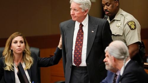 4/23/18 - Atlanta - Standing amidst his attorneys, including Amanda Clark Palmer (left), Tex McIver is handcuffed and taken into custody after the verdict.  The jury found Tex McIver guilty on four of five charges on their fifth day of deliberations today at the Tex McIver murder trial at the Fulton County Courthouse.   Bob Andres bandres@ajc.com