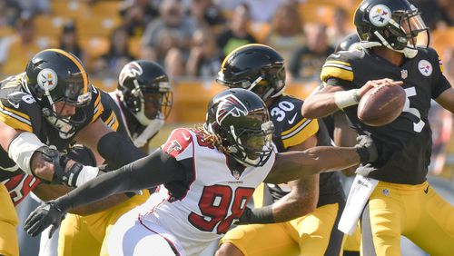 Atlanta Falcons defensive end Takkarist McKinley (98) reaches for Pittsburgh Steelers quarterback Joshua Dobbs (5) in the first half Sunday, Aug. 20, 2017, in Pittsburgh.