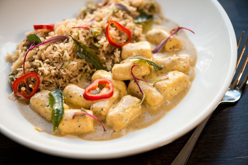 Paneer Gnocchi with lemongrass, curry leaf, coconut milk, and olive khichdi. Photo credit: Mia Yakel.