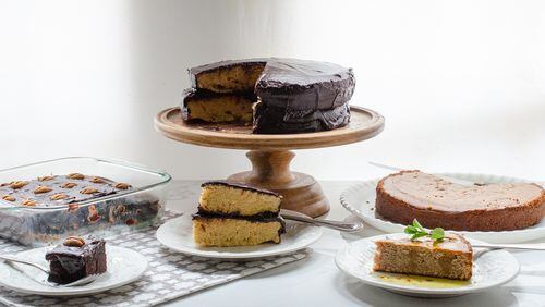 Leave the heavy mixer behind. You can whip up this trio of delicious cake recipes with a blender. From left, Gluten-Free Chocolate Snack Cake and Blender Yellow Layer Cake, both topped with Old-Fashioned Chocolate Frosting, and Vegan Lemon Olive Oil Cornmeal Cake. 
(Virginia Willis for The Atlanta Journal-Constitution)