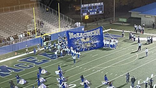 McEachern players prepare to take the field before their first-round playoff game against South Gwinnett on Nov. 12, 2021. McEachern won 34-28 in two overtime periods.