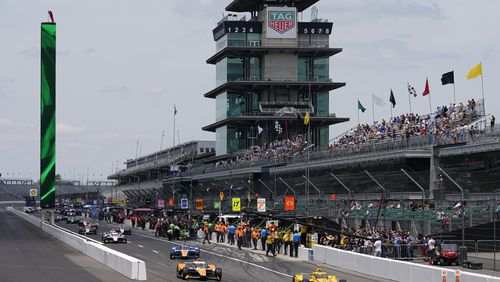 Scott McLaughlin, of New Zealand, leads a group of cars onto the track during a practice session for the Indianapolis 500 auto race at Indianapolis Motor Speedway, Monday, May 20, 2024, in Indianapolis. (AP Photo/Darron Cummings)