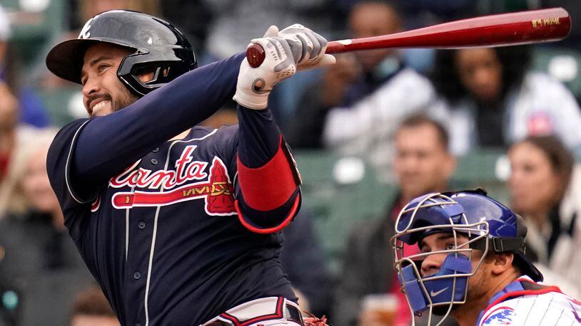Braves catcher Travis d'Arnaud hits a two-run home run during the first inning Sunday, April 18, 2021,  against the Chicago Cubs at Wrigley Field in Chicago. (Nam Y. Huh/AP)