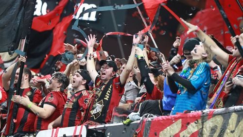 Atlanta United fans celebrate winning the MLS Cup 2-0 over the Portland Timbers on Saturday, December 8, 2018, at Mercedes-Benz Stadium in Atlanta. 9Photo: Curtis Compton/ccompton@ajc.com)