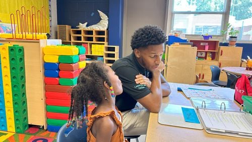 Zachary White works with 4-year-olds at Benteen Elementary as part of the Leading Men Fellowship, an innovative project that grew out of The Literacy Lab.
