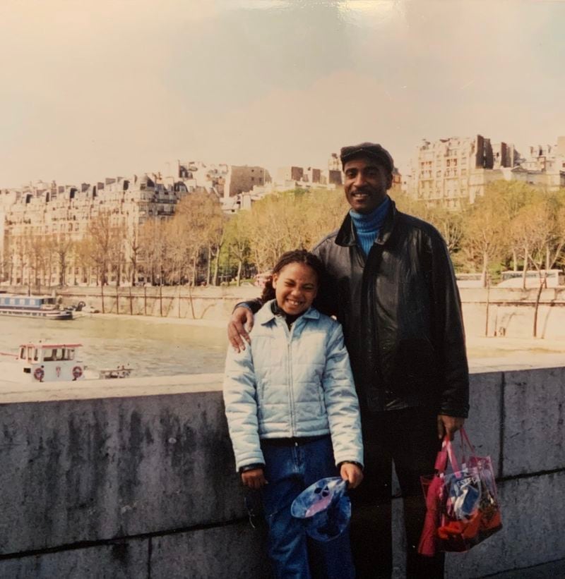 La’Nita Johnson developed a passion for travel as a child. Here, she's with her father, Steven, in Paris in 2001. (Courtesy of La’Nita Johnson)