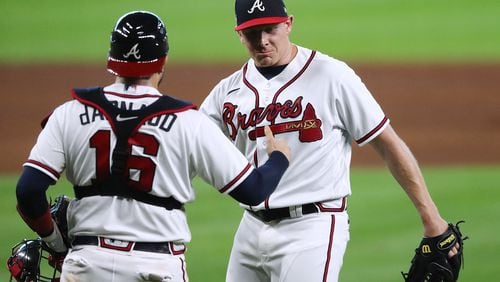 Braves closer Mark Melancon and catcher Travis d’Arnaud celebrate closing out 9-5 win over the Miami Marlins in Game 1 of the National League Division Series Tuesday, Oct 6, 2020, at Minute Maid Park in Houston.  (Curtis Compton / Curtis.Compton@ajc.com)