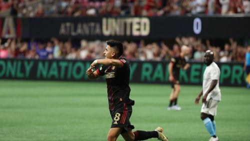 Atlanta United midfielder Thiago Almada reacts after scoring the team's first goal during the first half at Mercedes Benz Stadium in an MLS game between Atlanta United and the New Egland Revolution on Sunday, May 15,  2022. Miguel Martinez / miguel.martinezjimenez@ajc.com
