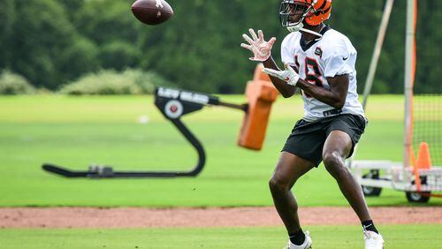 Bengals' wide receiver A.J. Green catches a pass during organized team activities Tuesday, May 22 at the practice facility near Paul Brown Stadium in Cincinnati. NICK GRAHAM/STAFF