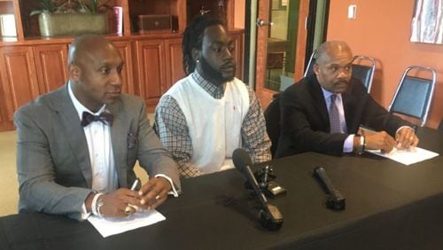 William Henry Miller, center, is suing Hapeville police following his wrongful arrest last year. Credit: Davis Bozeman Law Firm