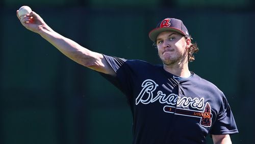 Atlanta Braves pitcher Jacob Webb loosens up his arm throwing in the field during spring training at the ESPN Wide World of Sports Complex on Sunday, Feb. 17, 2019, in Lake Buena Vista.    Curtis Compton/ccompton@ajc.com