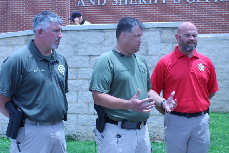 The bodies of Bryant Wade and Cameron Smith were found shortly after 11 a.m., Oconee County sheriff’s chief deputy Lee Reems (center) said during an afternoon news conference. He was joined by Capt. James Hale (left) and EMA director C.J. Worden. ASIA BURNS / ABURNS@AJC.COM