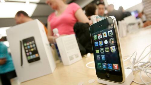 The new 3G iPhone is displayed on a table as customers buy the latest iPhone inside the Apple Store at Westfield Valley Fair in San Jose, Calif., on July 11, 2008. (Dai Sugano/Bay Area News Group/TNS)