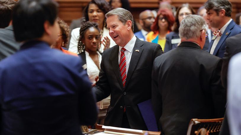 Gov. Brian Kemp greets legislators as he enters the House chambers on Sine Die, the last day of the General Assembly at the Georgia State Capitol in Atlanta on Wednesday, March 29, 2023. (Natrice Miller/ natrice.miller@ajc.com)