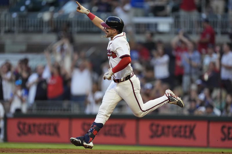 Atlanta Braves outfielder Jarred Kelenic (24) gestures was he rounds the bases after hitting a two-run home run off Boston Red Sox pitcher Kutter Crawford in the third inning of a baseball game Tuesday, May 7, 2024, in Atlanta. (AP Photo/John Bazemore)