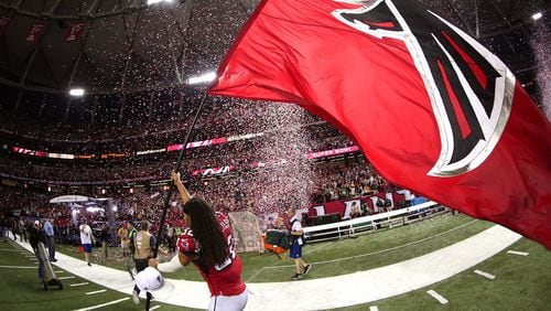 ATLANTA, GA - JANUARY 22: Jalen Collins #32 of the Atlanta Falcons celebrates with a Falcons flag after defeating the Green Bay Packers in the NFC Championship Game at the Georgia Dome on January 22, 2017 in Atlanta, Georgia. The Falcons defeated the Packers 44-21. (Photo by Tom Pennington/Getty Images)