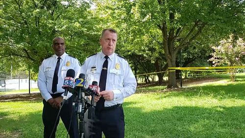 Atlanta police Deputy Chief Charles Hampton Jr. (left) and interim police Chief Darin Schierbaum (right) speak at a media briefing in Old Fourth Ward's Central Park following an apparent murder-suicide Aug. 4.