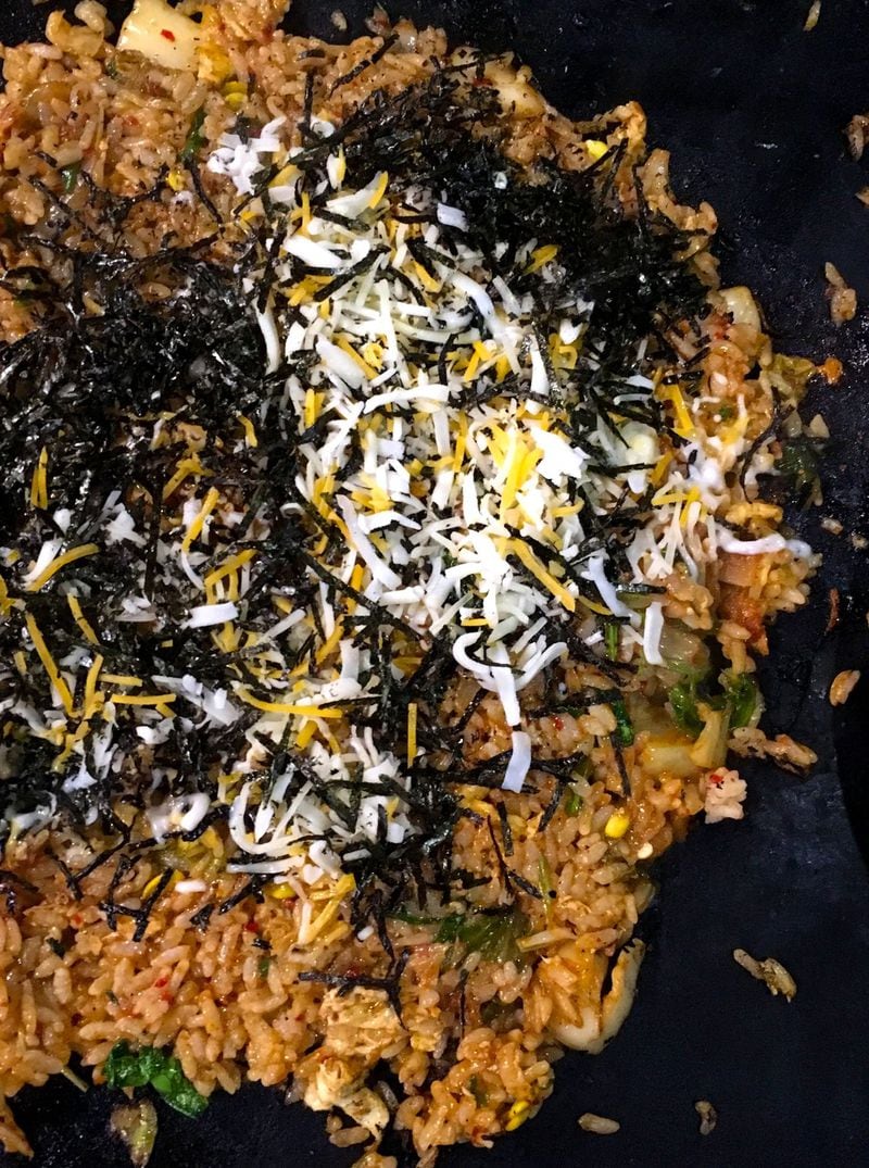 The servers at Miss Gogi finish the tabletop-cooked fried rice with a confetti of nori and cheese. CONTRIBUTED BY WYATT WILLIAMS
