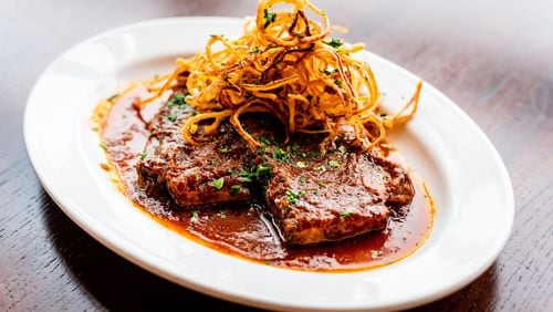 Daube — a homestyle pot roast, of brisket braised for hours — is complemented by a garnish of crisped onions at Lagarde American Eatery. CONTRIBUTED BY HENRI HOLLIS