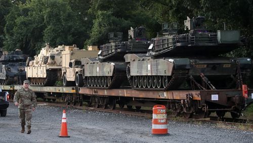 Two M1A1 Abrams tanks and other military vehicles sit on guarded rail cars at a rail yard on July 2, 2019 in Washington, DC. President Trump asked the Pentagon for military hardware, including tanks, to be displayed during the 4th of July Salute To America on the National Mall. Mark Wilson/Getty Images