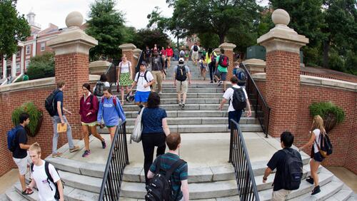 Students changing classes walk on the Baldwin Street Steps on the University of Georgia campus.