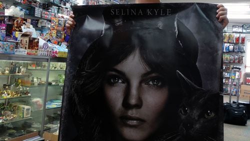 Camren Bicondova shows off a big poster of herself in "Gotham" at Oxford Comics & Books on Piedmont Ave. in Buckhead Sept. 3, 2014. CREDIT: Rodney Ho/rho@ajc.com