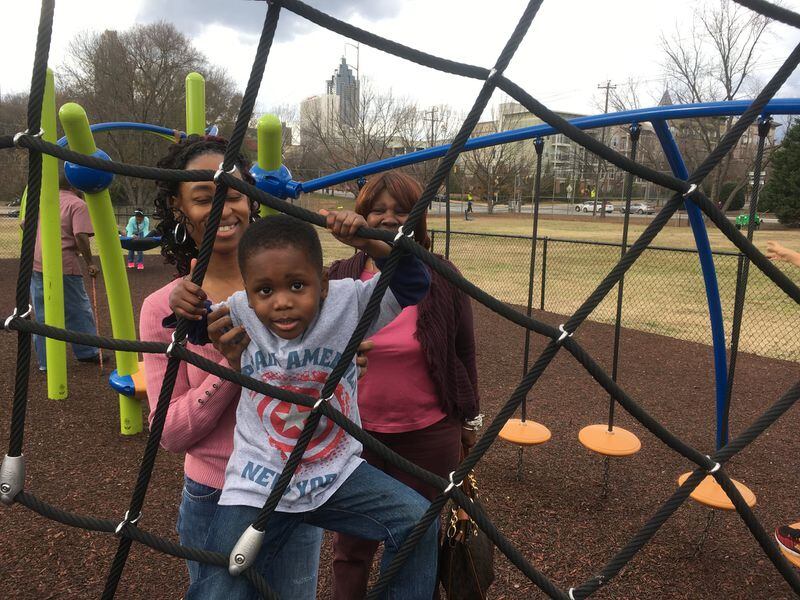 Monique Smith, left, with her son Michael and mom Earleen McLain at the playground outside the Martin Luther King Jr. National Historic Site on Saturday. Photo: Jennifer Brett, jbrett@ajc.com