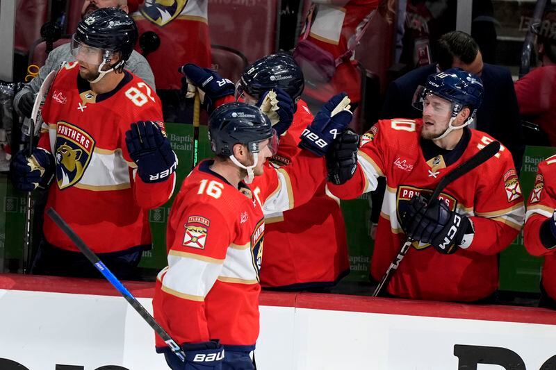 Florida Panthers center Aleksander Barkov (16) is congratulated after scoring a goal during the third period of Game 2 against the Boston Bruins of a second-round series of the NHL hockey Stanley Cup playoffs Wednesday, May 8, 2024, in Sunrise, Fla. (AP Photo/Lynne Sladky)